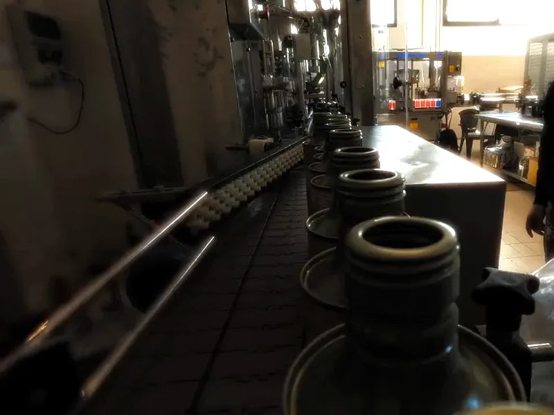 Tins moving down the filling line at the mill in Sicily